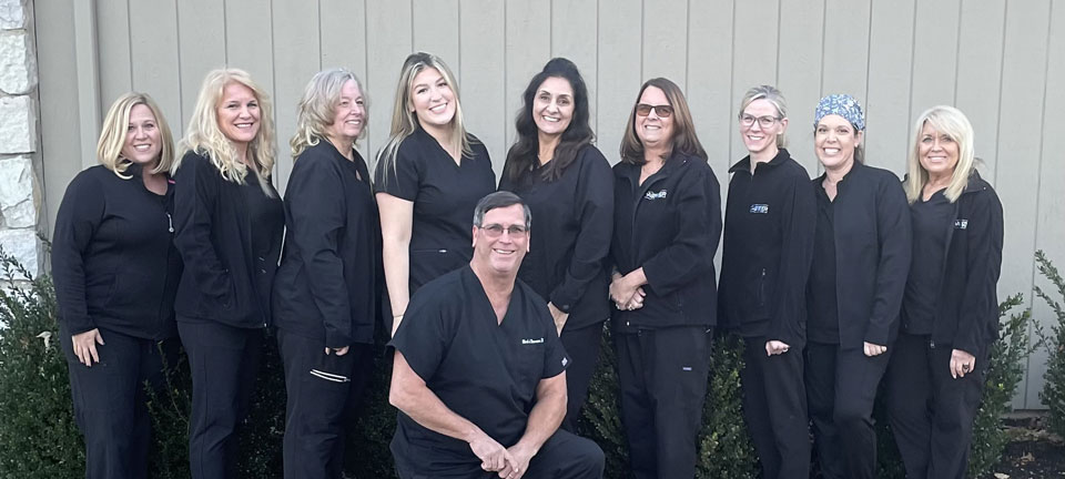 Dr. Mark Danner and staff standing outside of the dental practice office located in Sewell New Jersey