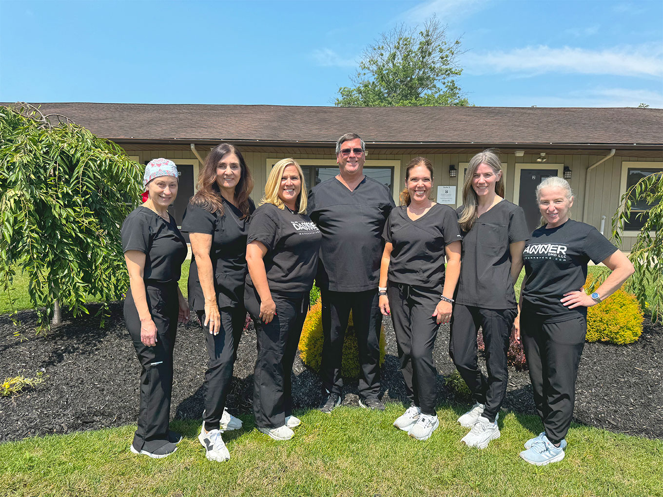 Dr. Mark Danner and staff standing outside of the dental practice office located in Sewell New Jersey